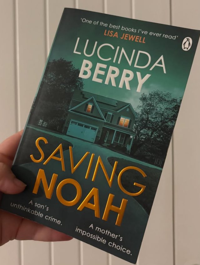 Fliss holding her copy of Saving Noah by Lucinda Berry